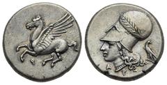 Ancient Greek World Corinthia. Corinth. Circa 375-300 BC. Stater (Silver, 20.58 mm, 8.60 g). Pegasus landing left; koppa below. Rev. Helmeted head of Athena left, helmet decorated with laurel branch; 