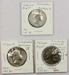 Ancient - Greek ANCIENT GREECE: LOT of 3 AR tetradrachms, including Seleukid: Antiochos III (SC-1042, Fine, cleaned), Demetrios I (SC-1638, F-VF, lightly cleaned); Ptolemaic: Ptolemy II (CPE-277, F-VF