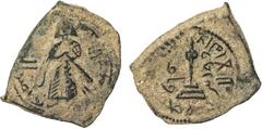 Islamic - Early Pre-Reform ARAB-BYZANTINE: Standing Caliph, ca. 692-697, AE fals (3.02g), Qûrus, A-3536, circle-on-steps reverse, mint name to right, waf to left, nice example of this rare mint, bold 