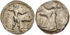 Bruttium, Kaulonia. Silver Nomos (7.63 g), ca. 500-480 BC. KAVΛO (retrograde), Apollo advancing right, holding branch; small daimon running right on Apollo's outstretched arm; to right, stag standing 
