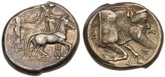 Sicily, Gela. Silver Tetradrachm (17.30 g), ca. 480-475 BC. Charioteer driving slow quadriga right; above, Nike flying right, crowning horses with wreath. rev. C-E-Λ-AΣ, forepart of man-headed bull to