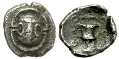 Lot 26.  BOEOTIA. Thebes. Circa 425-395 BC. AR Tetartemorion (6mm - 0.17 g). Boeotian shield; club to left across top of shield / Kantharos. BCD 454a (this coin); BMC 110 var. (club to right). VF, dar