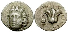 Lot 30.  ISLANDS off CARIA. Rhodos. Rhodes. Circa 205-200 BC. AR Drachm (16mm - 1.67 g). Uncertain mint in Crete or Rhodes. Ainetor, magistrate. Head of Helios facing slightly left / Rose with bud to 