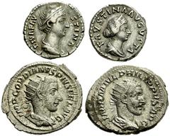 Lot 103.  Lot of Four Roman AR Issues. Includes the following: Faustina Sr. AR Denarius. Aeternitas standing left. RSC 101 // Faustina Jr. AR Denarius. Two boys seated on draped throne. RSC 190 // Gor