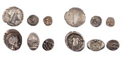 LOTS ANTIKER MÜNZEN Lot, griechische Münzen AR-Kleinnominale der griechischen Welt: KALABRIEN, Tarent, Hemilitron; LUKANIEN, Metapont, Diobol; ATTIKA, Athen, Tribobol; IONIEN, Ephesos, Tetartemorion; 