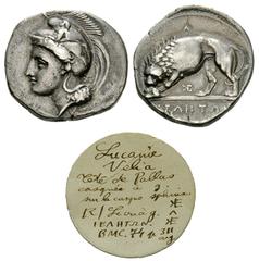 Velia AR Didrachm Velia, Lucania. AR Didrachm (21 mm, 7.35 g), c. 340-330 BC. Obv. Head of Athena left, wearing crested helmet decorated with centauress. Rev. YEΛHTΩN, lion to left, devouring prey; A 