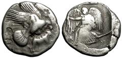 Olympia Stater, eagle with hare / Nike, rare, with an impressive pedigree Olympia , Elis. AR Stater (23 mm, 11.49 g), c. 440s-430s BC. Obv. Eagle flying right with wings spread, grasping hare with his