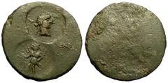 Uncertain AE22, countermarked with Caracalla head and winged deity Roman Provincial. Uncertain mint. AE22 (6.27 g). Obv. Flat. Countermarks: Laureate head of Caracalla right; below, facing winged figu