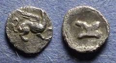 Ionia, Teos 420-400 BC, Tetartemorion, .25g: Obv: Griffin seated right Rev: Astralagos within an incuse square. Unpublished?.