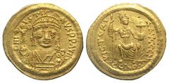 Byzantine BYZANTINE EMPIRE. Justin II, 565-578 AD. Gold Solidus (4.49 gm) of Constantinople. Helmeted bust facing / Consantinopolis seated. S.344. aXF.