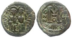 Byzantine BYZANTINE EMPIRE. Justin II, 565-578 AD. AE Follis (12.98 gm) of Nikomedia, yr. 7, A. Justin and Sophia enthroned / Large M. S.369. aVF, dark green patina.