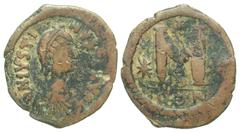 Byzantine BYZANTINE EMPIRE. Justin I, 518-527 AD. AE Follis (14.28 gm) of Constantinople. Diaemed draped bust, cross on diadem / Large M between two stars. S.62. Fine+, brown patina. Rare with cross.