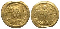 Byzantine BYZANTINE EMPIRE. Justinian I, 527-565 AD. Gold Solidus (4.29 gm) of Constantinople. Helmeted bust facing / Angel standing. S.140. VF+.