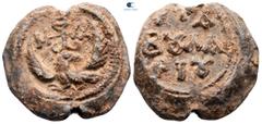 Byzantine circa AD 1000-1200. Thomas Taboularios Seal Pb 25 mm, 18,89 g Eagle, with spread wings, standing to left with head reverted; cruciform monogram of ΘωΜΑ above / + ΤΑ-Β૪ΛΑ-ΡΙ૪ ([Seal of] Thoma