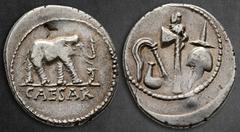 Roman Republican Julius Caesar 49-48 BC. Military mint travelling with Caesar Denarius AR 21 mm, 3,81 g CAESAR, Elephant advancing right, trampling upon horned serpent / Emblems of the pontificate: si