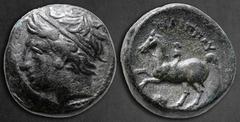 Greek Kings of Macedon. Uncertain mint in Macedon. Philip II of Macedon 359-336 BC. Bronze Æ 17 mm, 7,07 g Diademed head of Apollo left / ΦIΛIΠΠOY, youth on horseback left; below horse, lion head left