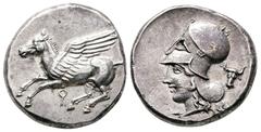 Greek Corinthia. Corinth circa 405-345 BC. Stater AR 20 mm, 8,69 g Pegasos flying to left; Ϙ below / Head of Athena to left, wearing Corinthian helmet; bucranium behind. extremely fine BCD Corinth 59;