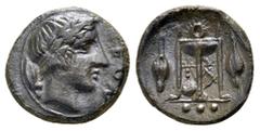 Sicily, Leontinoi. Circa 405-402 BC. Æ Tetras. Head of Apollo right, wearing laurel wreath; olive leaf and berry to left / Tripod; kithara within legs, barley grains flanking, ••• (mark of value) in e