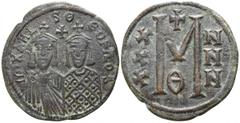 Michael II with Theophilus AD 820-829. Byzantine Follis Æ 28mm., 7,16g. Two facing busts; on the left, Michael; on the right, Theophilos, between them, cross and pellet / M; to left, X/X/X; to right, 