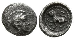 Greek Lycia. Tlos. Uncertain Dynast circa 400 BC. Hemiobol AR 6mm., 0,21g. Head of Athena facing to right, wearing a crested Attic helmet decorated with a volute and olive-leaves / F-A, panther sittin