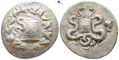 Greek Lydia. Tralleis circa 166-67 BC. Cistophoric Tetradrachm AR 27mm., 12,31g. Cista Mystica from which snake coils, around, ivy wreath with fruits / Two snakes coiled around a bow case, between the