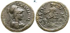 Roman Provincial Lydia. Sala. Pseudo-autonomous issue AD 98-117. Bronze Æ 19mm., 5,21g. Helmeted bust of Athena right, wearing aegis / Kybele seated left on throne, holding patera and resting elbow up