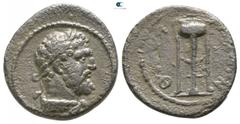 Roman Provincial Lydia. Thyateira . Semi-autonomous issue circa AD 161-211. Bronze Æ 15mm., 2,80g. Laureate head of Herakles right, lionskin knotted around neck / ΘYATIΡHNΩN, tripod. nearly very fine 