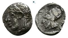 Greek Asia Minor. Uncertain mint circa 400-300 BC. Tetartemorion AR 5mm., 0,15g. Head of Apollo left, wearing taenia / Helmeted head of Athena left within incuse square. very fine CNG E-378, lot 161.