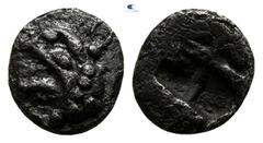 Greek Ionia. Teos 500-450 BC. Tetartemorion AR 5mm., 0,34g. Head of griffin left / Quadripartite incuse square. very fine