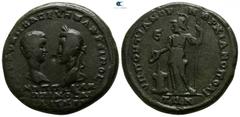 Roman Provincial Moesia Inferior. Marcianopolis. Macrinus and Diadumenian AD 217-218. Bronze Æ 26mm., 13,40g. Confronted heads of Diadumenian, bare and Macrinus, laureate / Athena standing left, holdi