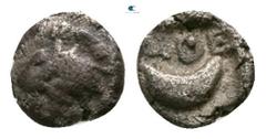 Greek Attica. Athens circa 450-404 BC. Tetartemorion AR 3mm., 0,16g. Head of Athena facing right, wearing Attic helmet / ΑΘΕ, crescent moon, within incuse square. very fine SNG Munchen 87.