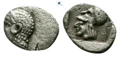 Greek Mysia. Lampsakos circa 500-450 BC. Tetartemorion AR 5mm., 0,15g. Head of Apollo left, wearing taenia / Helmeted head of Athena left within incuse square. very fine Asia Minor Coins, #12762.