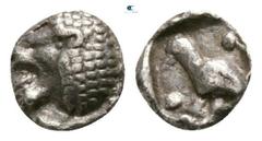 Greek Caria. Mylasa circa 420-390 BC. Tetartemorion AR 4mm., 0,17g. Head of roaring lion left / Bird standing left, pellets flanking, all within incuse square. very fine SNG Kayhan 947 var. (lion to r