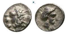 Greek Caria. Uncertain mint circa 400-350 BC. Tetartemorion AR 3mm., 0,09g. Head of lion left / Female head to right. very fine Traité II -; SNG Copenhagen -; Klein -; SNG Tübingen -.