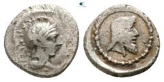 Greek Dynasts of Lycia. Uncertain mint. Kherei 410-390 BC. Obol AR 6mm., 0,52g. Head of Athena right, wearing crested Attic helmet / Bearded head of dynast right, wearing kyrbasia, within dotted borde