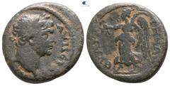 Roman Provincial Lydia. Thyateira . Trajan AD 98-117. Bronze Æ 16mm., 4,87g. AYT NE[P TPAIANON], laureate head right / ΘYATEI-ΡHNΩN, Nike walking left, holding wreath in right and palm branch in left 