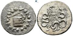 Greek Mysia. Pergamon circa 166-67 BC. Struck circa 104-98 or 92-88 BC Cistophoric Tetradrachm AR 25mm., 11,50g. Basket (cista mystica) from which snake coils, around, ivy wreath with fruits / Two sna