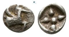 Greek Asia Minor. Uncertain mint circa 520-480 BC. Tetartemorion AR 3mm., 0,11g. Forepart of a winged horse to right / Star of four rays with central pellet, all within incuse square. nearly very fine