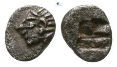 Greek Ionia. Kolophon 525-500 BC. Tetartemorion AR 4mm., 0,17g. Archaic head of Apollo to left / Quadripartite incuse square. nearly extremely fine SNG Kayhan 343; SNG von Aulock 1810.
