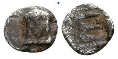 Greek Ionia. Kolophon circa 480-450 BC. Tetartemorion AR 4mm., 0,22g. Facing head of Apollo Klarios with long-hanging hair / TE monogram in incuse square. nearly very fine Milne, Kolophon (NNM 96), 7.