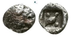 Greek Ionia. Miletos circa 525-500 BC. Tetartemorion AR 4mm., 0,26g. Forepart of lion left, head looking backwards, with open jaws and tongue protruding / Bird standing right between two pellets diago