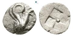 Greek Ionia. Teos circa 460-420 BC. Tetartemorion AR 4mm., 0,11g. Griffin seated right, left paw raised / Incuse square of mill-sail pattern, pellet in center. very fine Balcer -; SNG Kayhan -; SNG Co