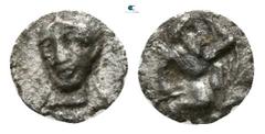 Greek Cilicia. Uncertain mint 350 BC. Tetartemorion AR 3mm., 0,09g. Persian king in kneeling-running stance right, holding dagger and bow / Female bust facing, wearing collar. very fine