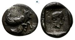 Greek Dynasts of Lycia. Uncertain mint. Uvug circa 470-440 BC. Obol AR 7mm., 0,65g. Forepart of winged man-headed bull right / OFOV, male head right within dotted border, all within incuse square. ver