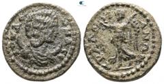 Roman Provincial Lydia. Tralleis. Julia Domna AD 193-217. Bronze Æ 18mm., 4,65g. IOV ΔO-MNA CE, draped bust right, set on crescent / TΡAΛΛ-I-ANΩN, Nike walking left, holding wreath and palm branch. ve