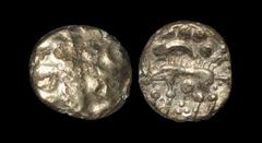 Celtic Iron Age Coins - Iceni - Norfolk Wolf Gold Stater 60-54 BC "Obv: wreath motif. Rev: wolf left with bristly back, two pellets (testes?) below tail, 'bird' on rump, five large pellets and crescen