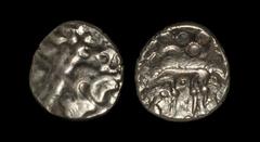 Celtic Iron Age Coins - Iceni - Norfolk Wolf Gold Stater 30-10 BC. Obv: wreath motif with cloak and crescents. Rev: wolf left with large pellets above with small pellet over pellet trefoil below. The 