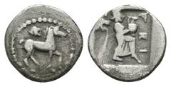 Ancient Greek Coins - Larissa - Horse Obol 479-460 BC. Obv: horse trotting right; lion's head above. Rev: LARI legend with the nymph Larissa standing right, holding a hydria on her knee, lion's head f