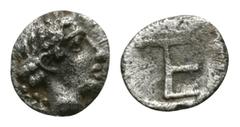 Greek - Ionia - Kolophon - Autonomous Tetartemorion 490-400 BC. Obv: head of Apollo right. Rev: TE monogram in incuse square. Rare. Milne NNM 96, 34; SG 4343 var.; cf. Wildwinds (this coin"). 0.30 gra
