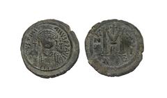 Ancient Byzantine Coins - Justinian I - Bronze 527-565 AD. Nicomedia mint, dated regnal year 21. Obv: DN IVSTINIANVS PP AVG legend with helmetted, cuirassed bust facing, holding cross on globe and shi